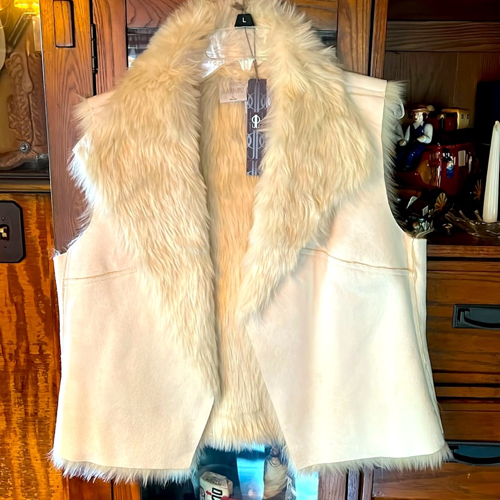 White leather and fur vest.